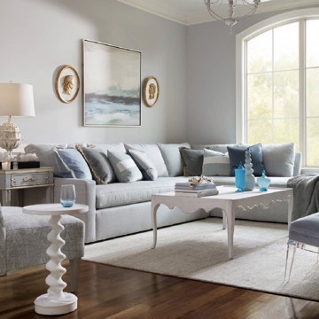 Theodore Alexander upholstered sofa with white end table and cocktail table